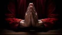 praying hands with red shirt