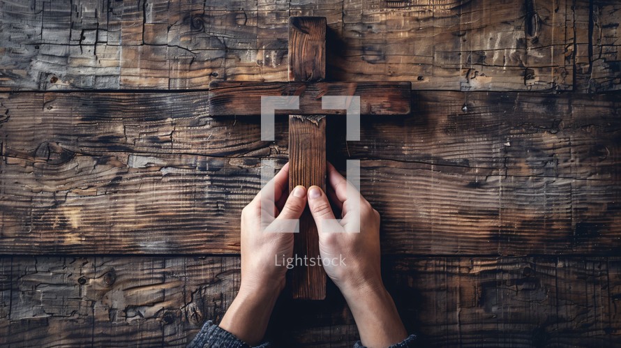 Holding a wooden cross