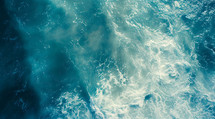 Open ocean aerial birds-eye view of waves