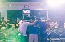 friends comforting each other and praying 