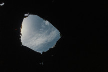 view of the sky from a hole 