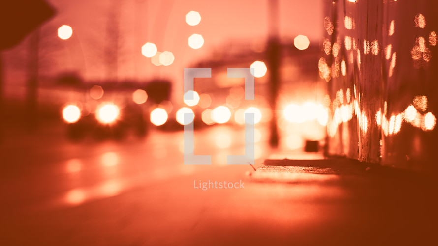 bokeh lights from cars on a street 