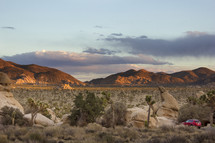parked car and desert landscape 