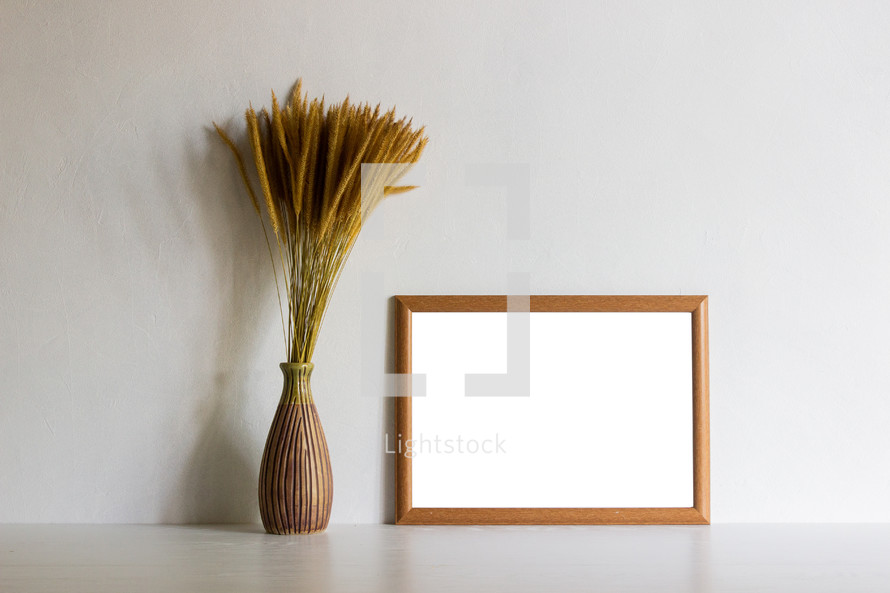 fuzzy grasses and blank frame 