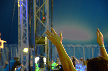 raised hands worshiping 