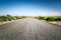 gravel road through a desert 