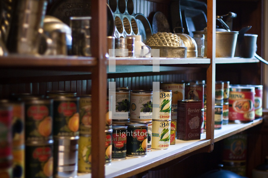  shelves filled with canned goods and tin pans - clean out your pantry