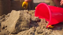 child building a sand castle 