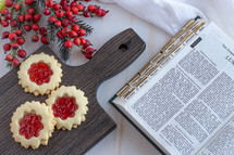 Christmas cookies and open Bible 