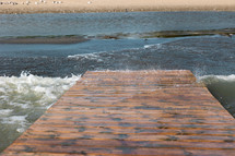 Waves spashing through dock