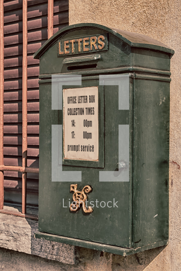 An old green post office box.