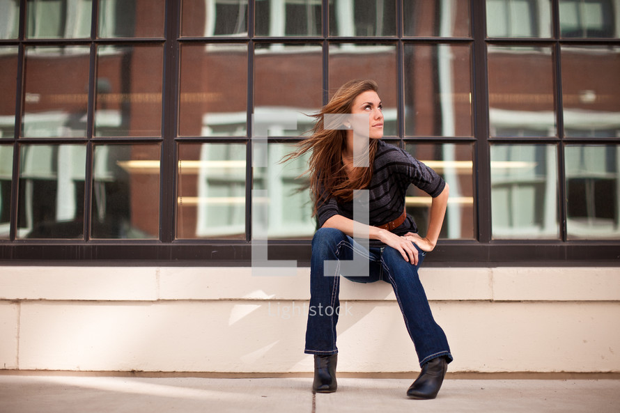 woman sitting and looking to the side