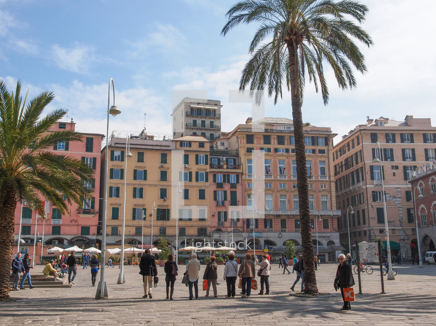 GENOA, ITALY - MARCH 16, 2014: Tourists visiting the old town area in spring