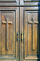 crosses on a wood door