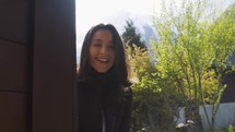 Happy beautiful woman at a ski chalet in Chamonix France, slow motion

