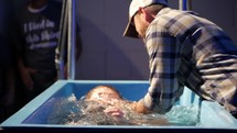 young woman being baptized 