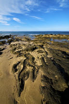 rocks and sand on a beach 