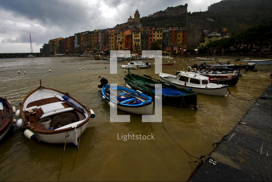 boats docked along an Italian coastline 