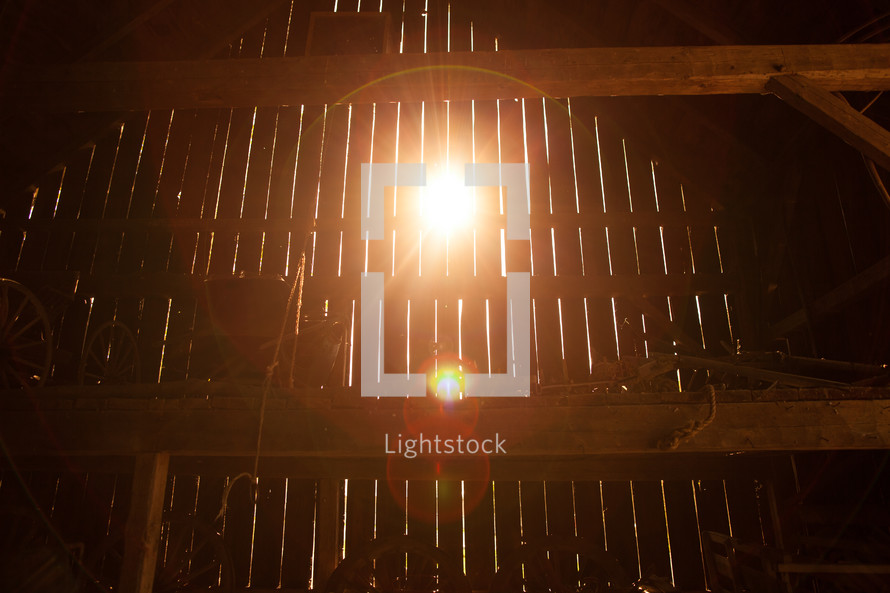 sunlight through slates in a barn 