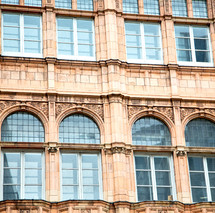 large windows on an old building in London 