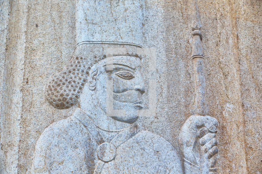 the bas relief of an antique warrior