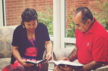 husband and wife reading Bibles together 