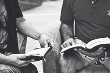 two men reading Bibles at a Bible study 
