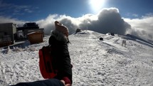 Girl keeping hands together with the cameraman on top of The Bucegi Mountains, in Romania - slow motion shot