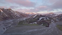 Aerial sunset over rainbow volcanic mountains in Iceland
