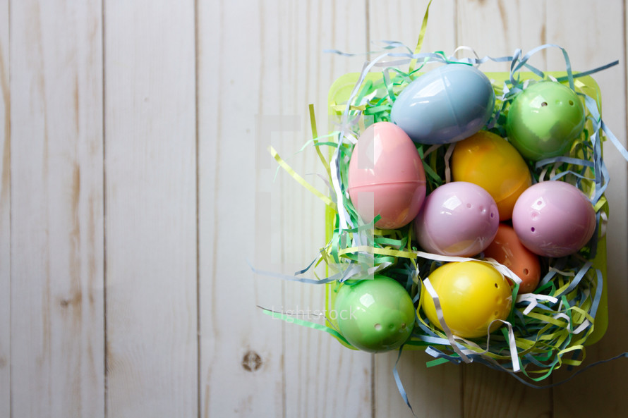 plastic Easter eggs in an Easter basket 