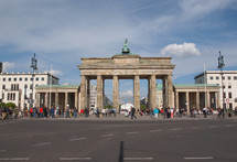 BERLIN, GERMANY - MAY 09, 2014: Tourists visiting the Brandenburger Tor (Brandenburg Gate) linking East and West Berlin