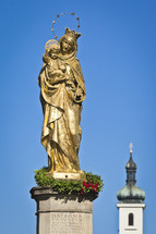 Mary with Jesus golden statue 