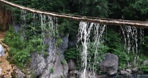 Water Drops At The Rope Hanging At Sipote Waterfall In Salciua Commune, Alba County, Romania. static shot