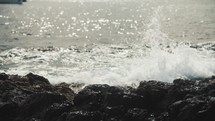 Waves crashing against a rocky beach in the Canary Islands.