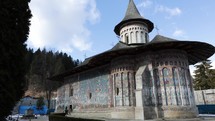 Voronet Blue Monastery - UNESCO World Heritage Site In Gura Humorului, Suceava County, Romania. Wide Shot
