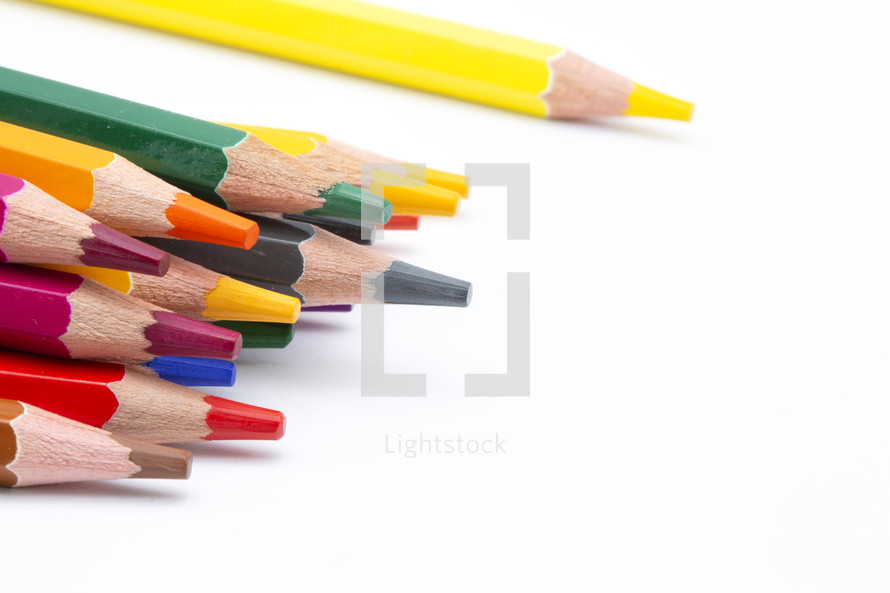 colored pencils on a white background 