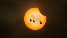 Solar eclipse with military helicopters

