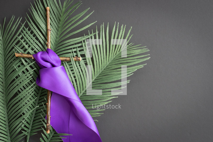 palm fronds, cross, and purple sash 