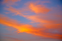 vibrant orange clouds in the sky at sunset 