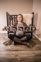 pregnant woman holding ultrasound picture 