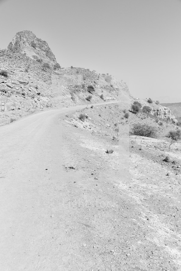 dirt road through a desert landscape 