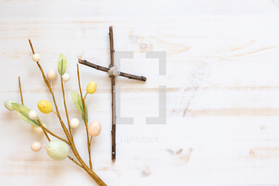 cross of sticks and Easter decorative spray 