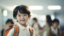 Back to school concept. Portrait of asian school boy with backpack in school environment.