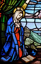 stained glass window of Mary at the annunciation of our Lord