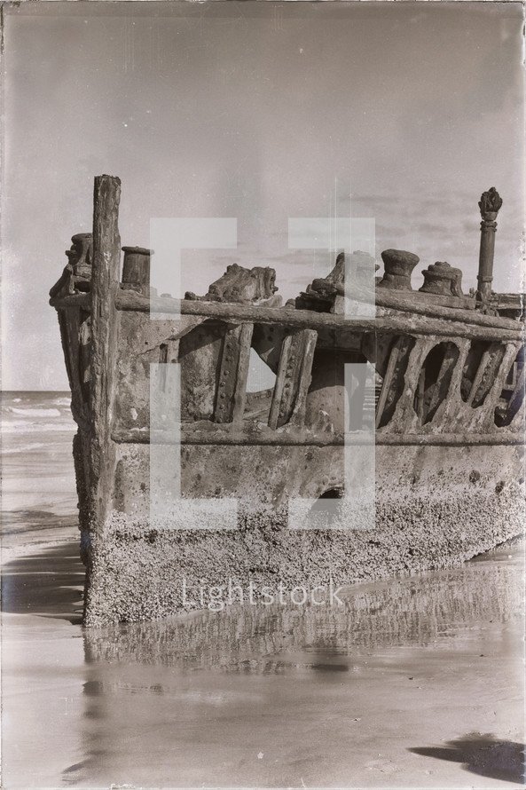 corroded rusty boat on a shore 