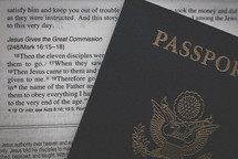 Passport on the pages of a Bible 