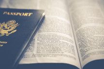 passport on the pages of a Bible 