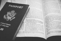 a Passport on the pages of a Bible 