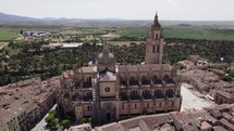 Tourist attraction Segovia Cathedral, aerial orbit. Vast countryside	