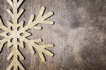 snowflake ornament on a wood background 